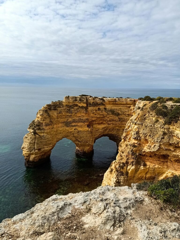 Golden sea cliffs and hidden caves along Praia da Marinha in Algarve, Portugal