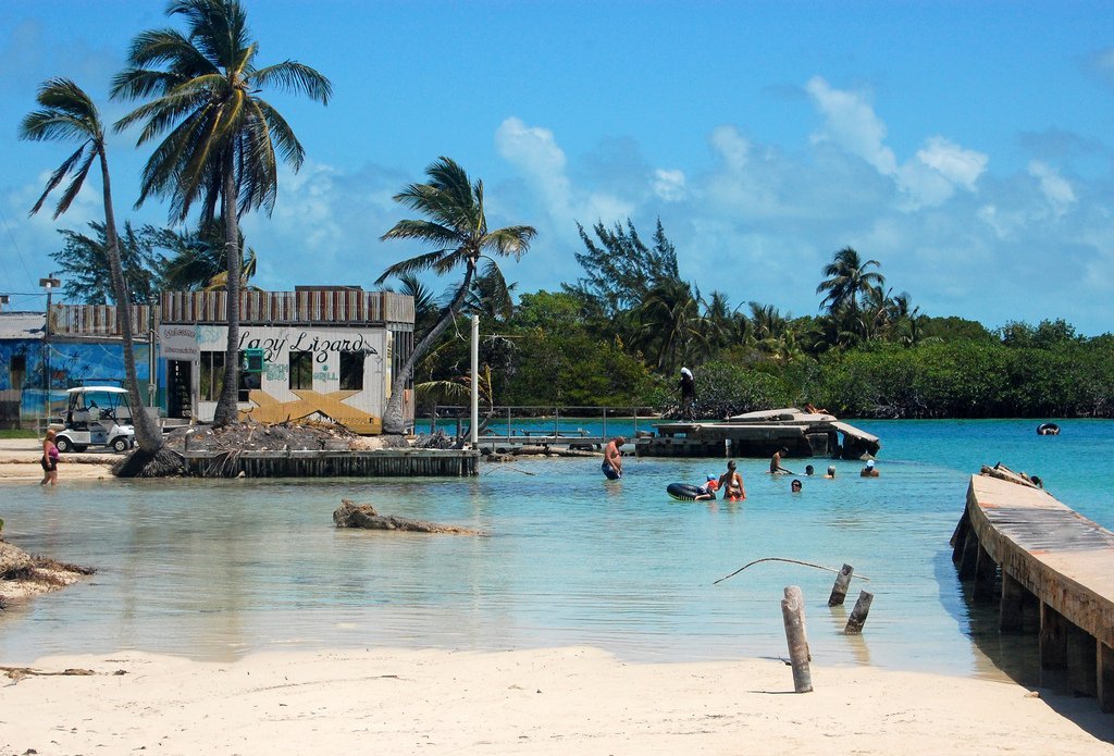 Relaxed island vibes with swimmers and docks at The Split in Caye Caulker, Belize